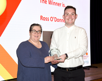 Active Schools Sports Development Volunteer Awards 2023. Councillor Elizabeth Robertson presenting a trophy to winner Ross O'Donnell.